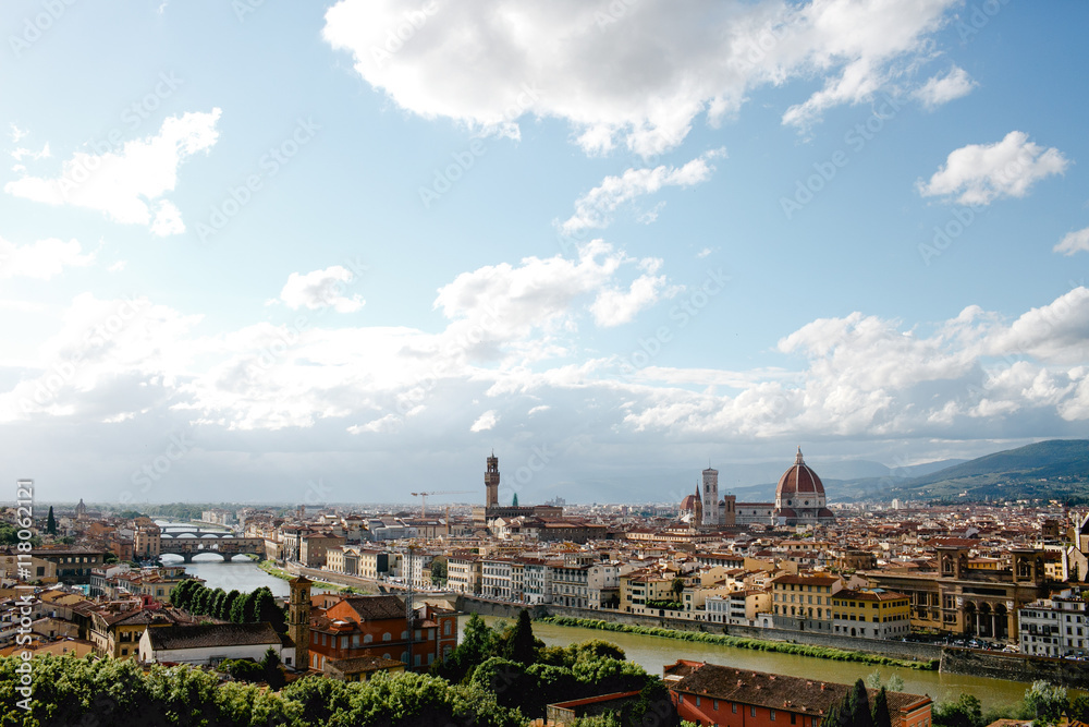 White clouds fly over the houses of Florence