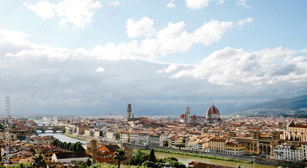Florence looks gorgeous while white clouds fly over it in a sunn