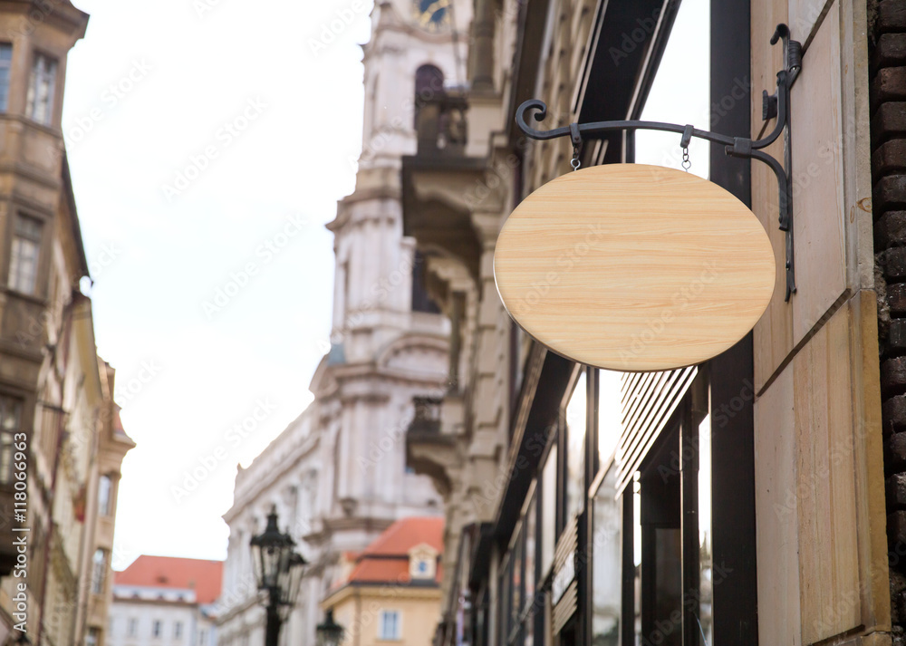 Empty wooden signboard on a european street. Architectural detail