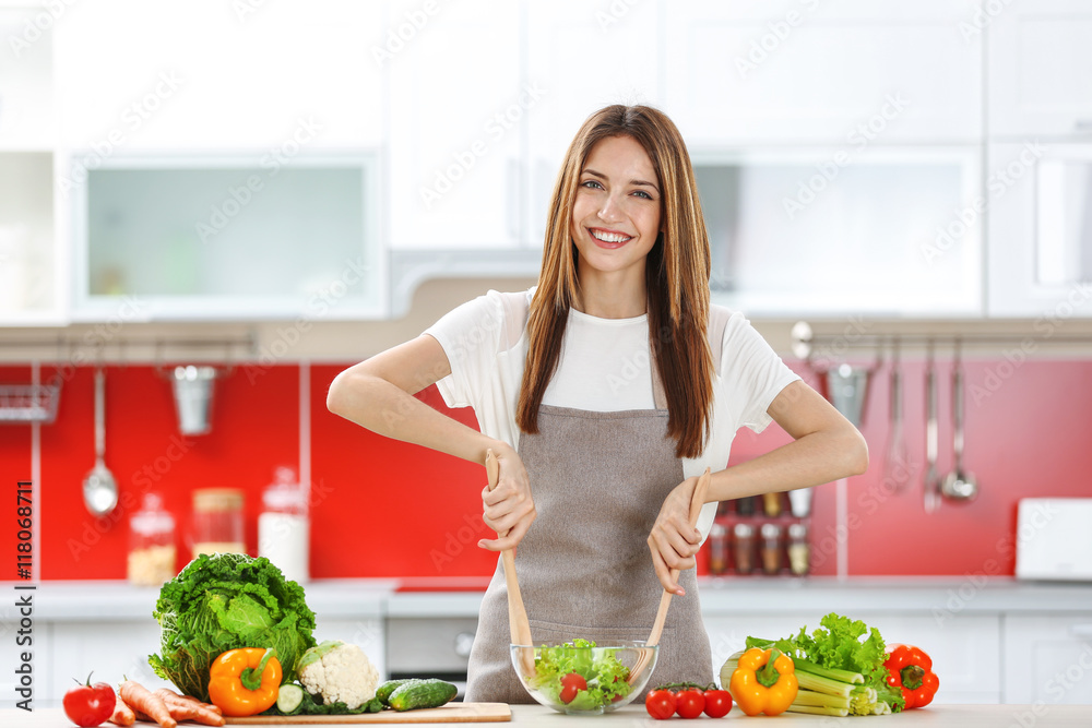 Woman cooking healthy food in the kitchen Woman cooking healthy food in the kitchen