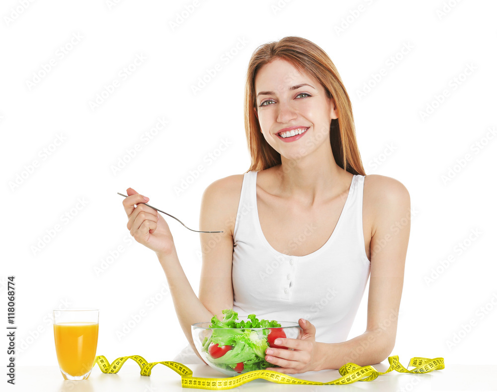 Woman with tablet eating healthy food on white background Woman with tablet eating healthy food on white background