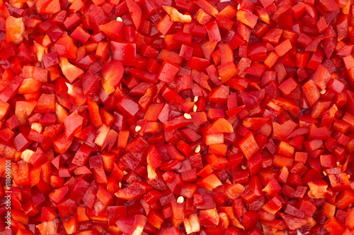 Chopped red peppers texture background.