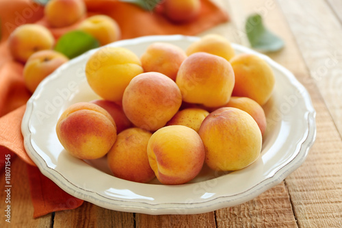 Fresh apricots on plate