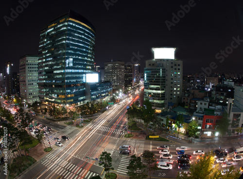High angle shot of night metropolis Seoul in South Korea. Illuminated buildings and busy city motorways