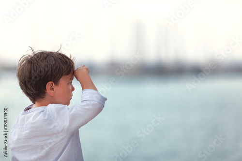 Portrait of happy boy on background of sea,