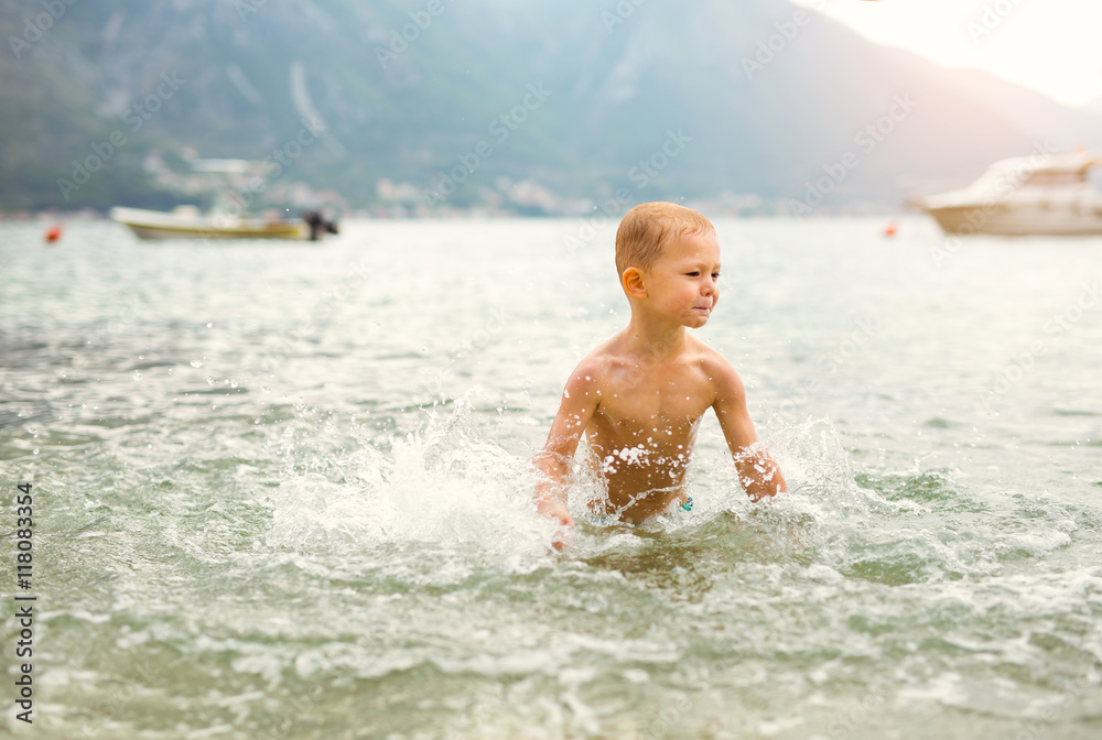 Children playing in the sea. Children playing in the sea.