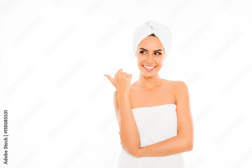 Happy smiling girl with towel on her head gesturing with finger Happy smiling girl with towel on her head gesturing with finger