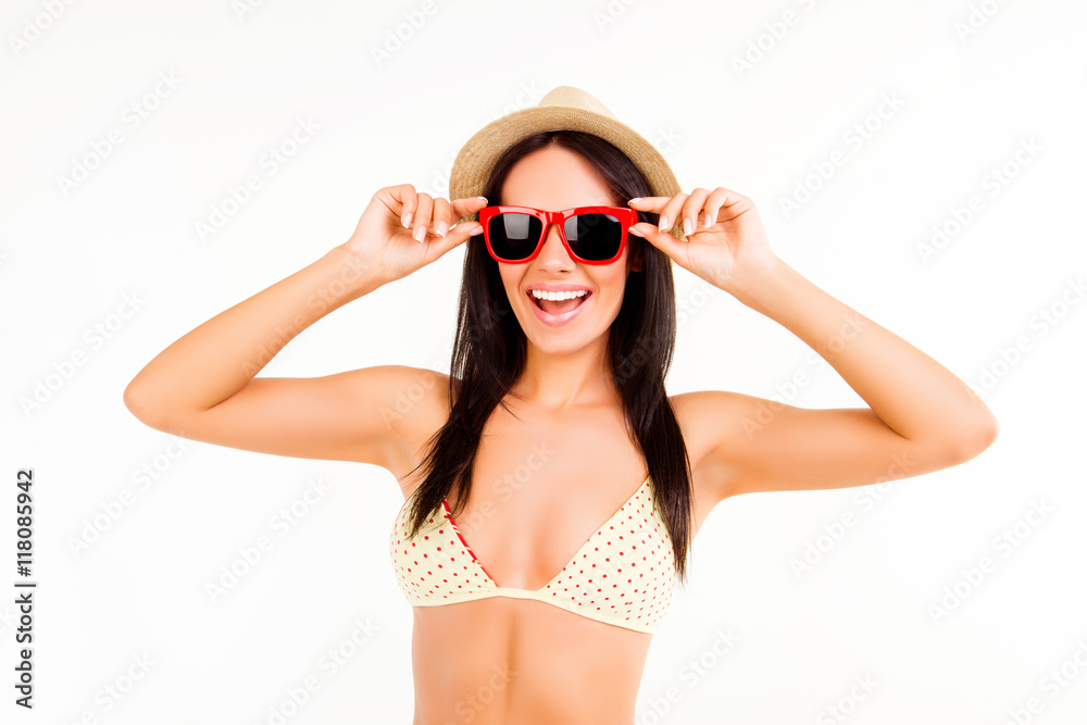 Beautiful happy woman in summer hat and spectacles laughing