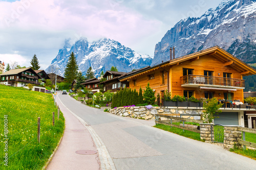 Grindelwald village scattered on the  green slopes. Switzerland  © volgariver