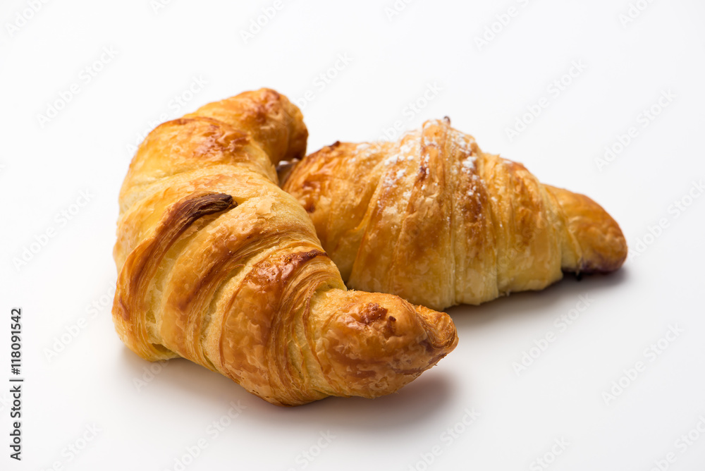 fresh buttered and blueberry lavender croissants, isolated on white background. close up, horizontal