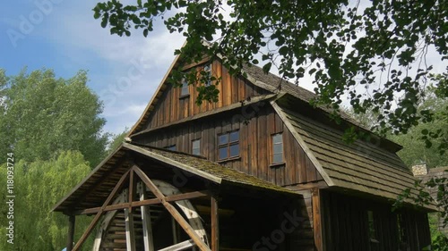 Wooden House in the Forest on a Sunny Day photo