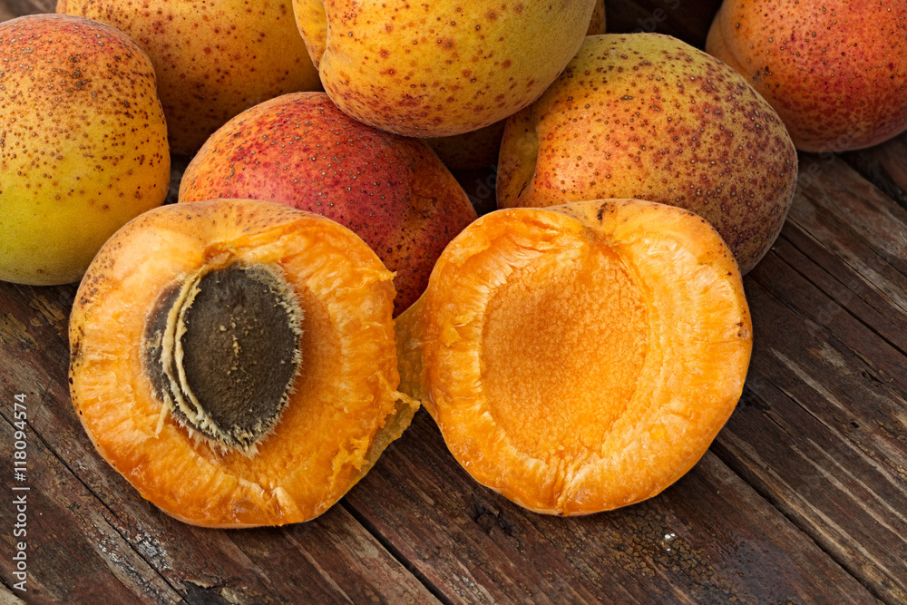 Apricots on a rough wooden background Apricots on a rough wooden background