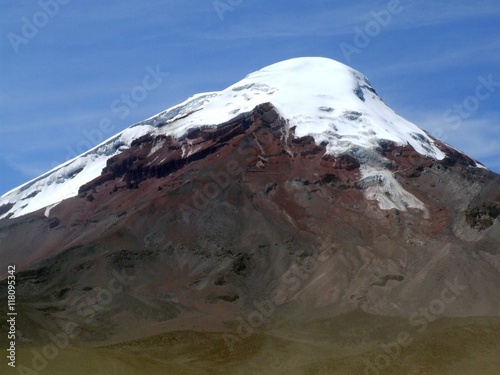 glaciars retreating on Mt. Chimborazo in Ecuador  s andes. Where the lava rocks have been covered by the glaciar until recently  they appear as fresh red.