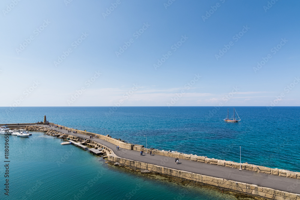 KYRENIA, NORTHERN CYPRUS - MAY 2016: Stone pier in Mediterranean sea KYRENIA, NORTHERN CYPRUS - MAY 2016: Stone pier in Mediterranean sea