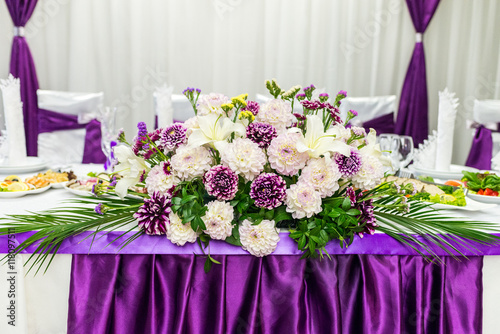 food table decorated with flowers © okskukuruza