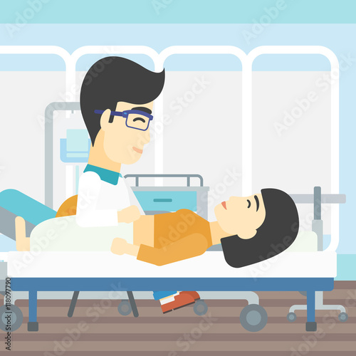 Doctor touching abdomen of female patient.