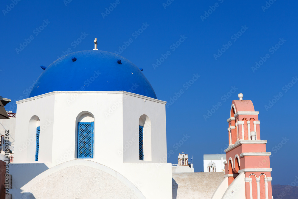 Blue dome and church bells of Oia, Santorini.