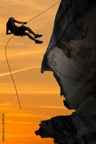 Silhouette of a climber over beautiful sunset