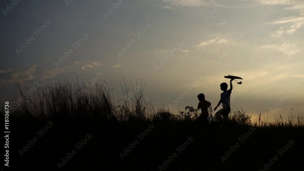 Slow motion: Happy Child Playing with an airplane on a meadow Slow motion: Happy Child Playing with an airplane on a meadow