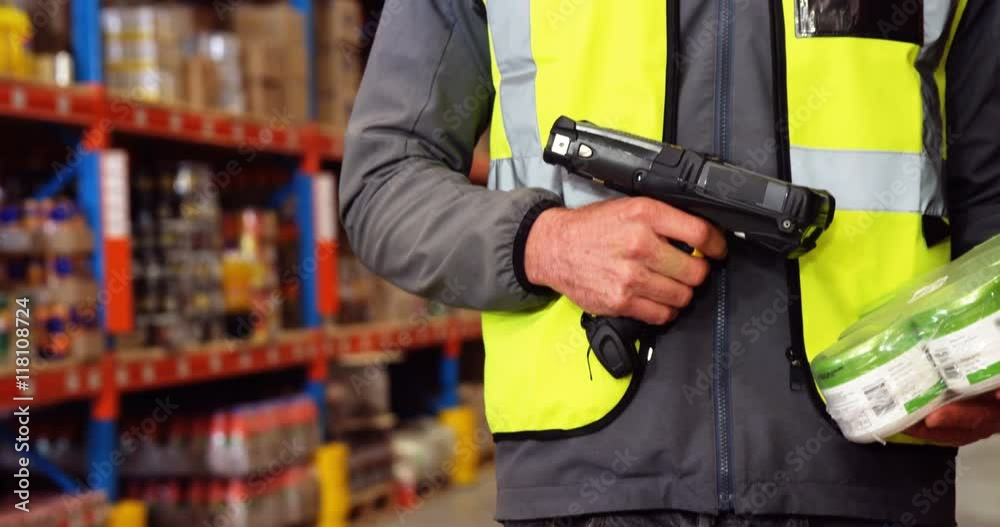 Warehouse worker using a scanner Warehouse worker using a scanner