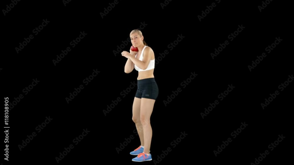 Sporty woman preparing her shot put Sporty woman preparing her shot put