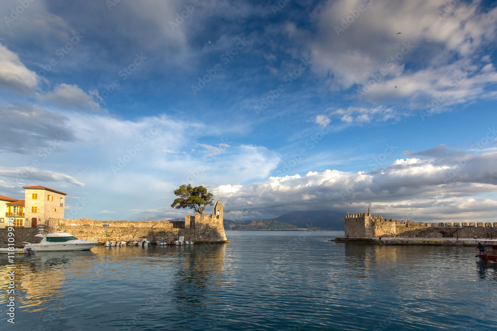 Amazing Sunset of Fortification at the port of Nafpaktos town, Western Greece