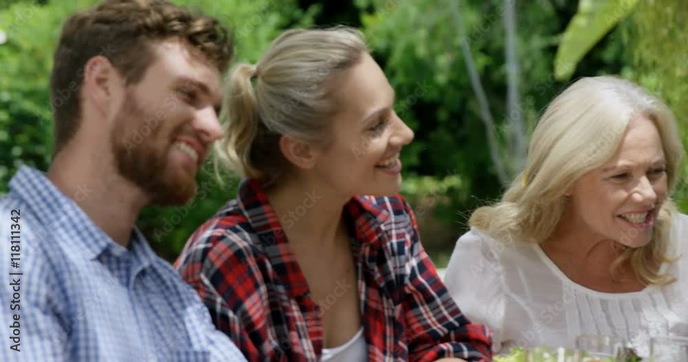 Happy family looking children in the garden Happy family looking children in the garden