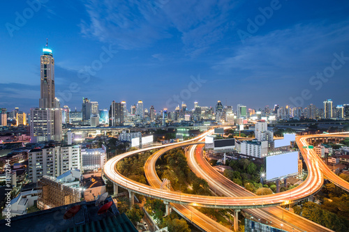 Long exposure, Aerial view highway interchanged with city downtown background photo