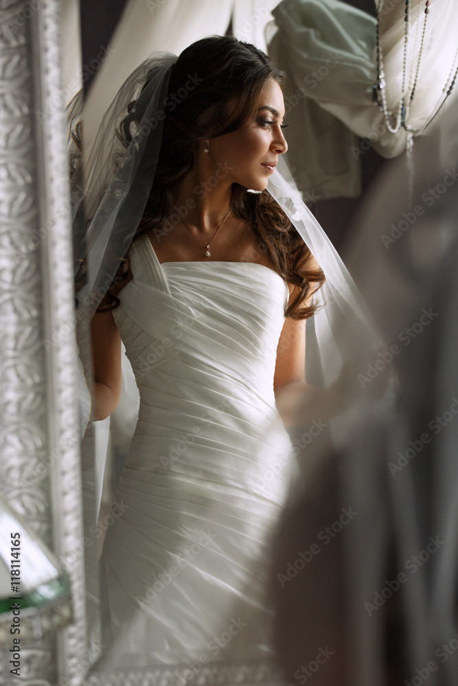 Beautiful slim bride in the elegant ...