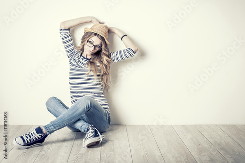 Young woman sitting on the floor  photo