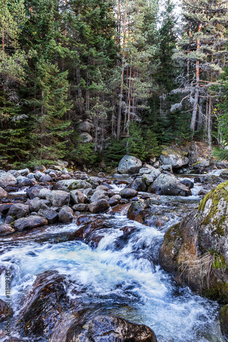 Beautiful bright contrasting mountain landscape. The  river photo