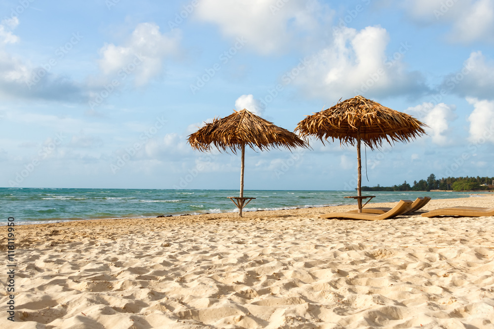 Beach umbrellas and sun loungers on the beach
