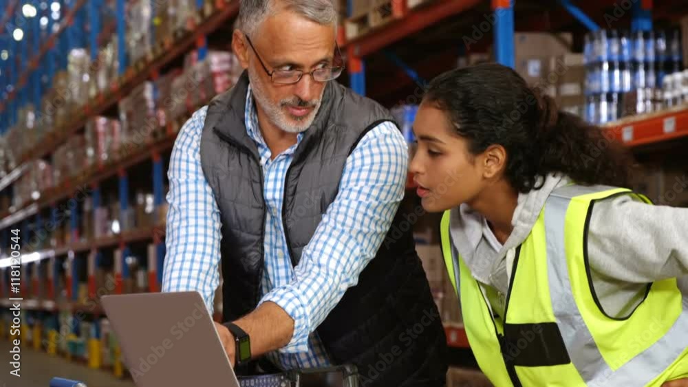Warehouse workers working together 
