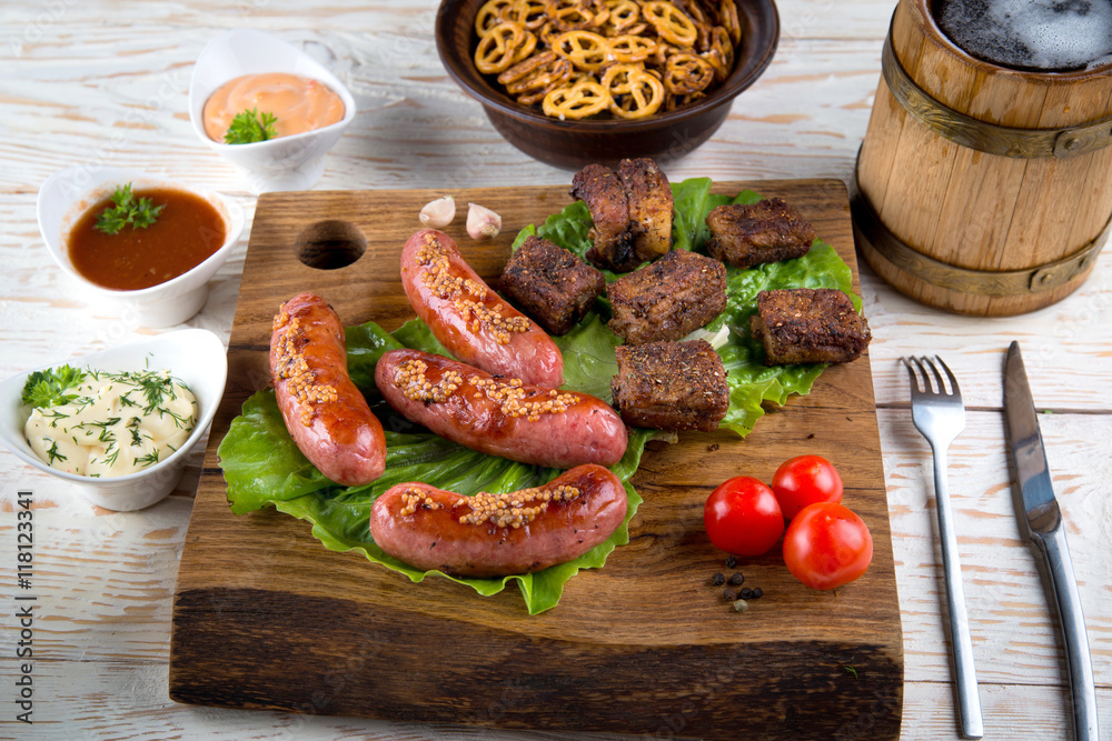 sausages and pork ribs grilled with beer
