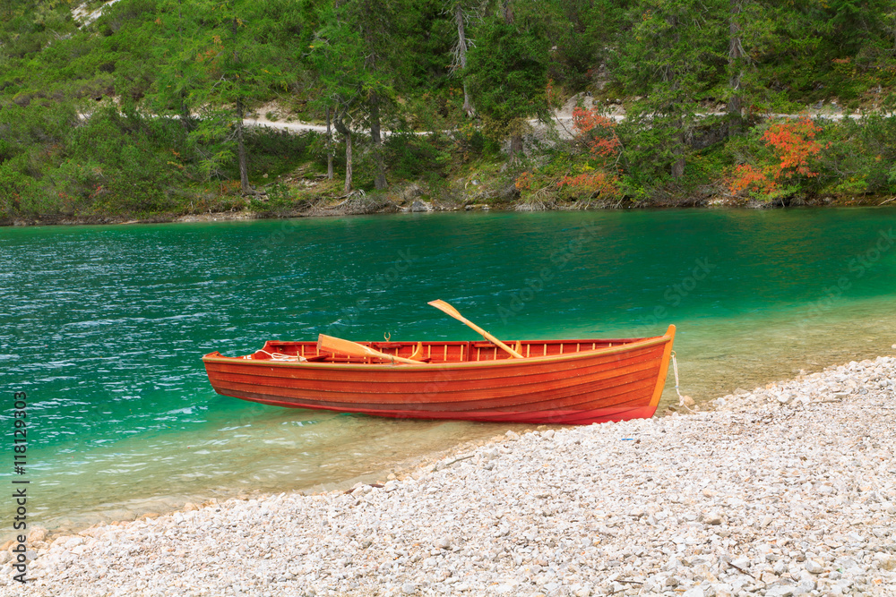 Boat on the Braies lake in the Dolomites Boat on the Braies lake in the Dolomites