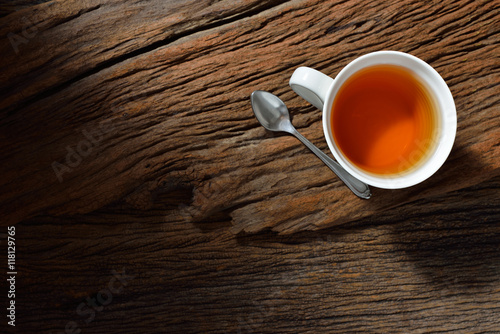 Top view of a cup of tea on wooden table photo