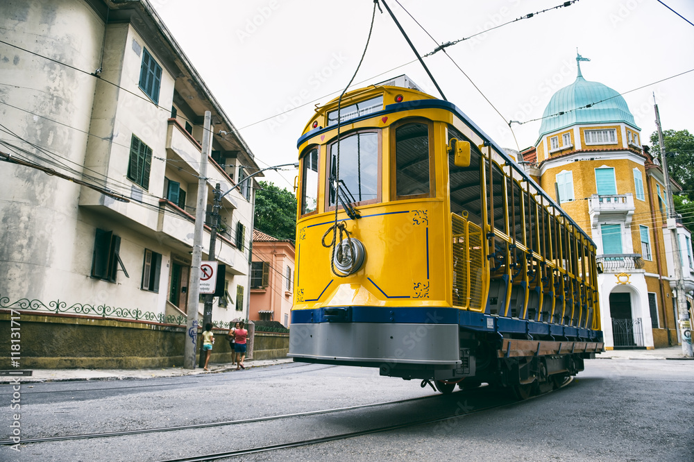 Iconic bonde tram travels along the streets of the tourist nieghborhood of Santa Teresa in Rio de Janeiro, Brazil 