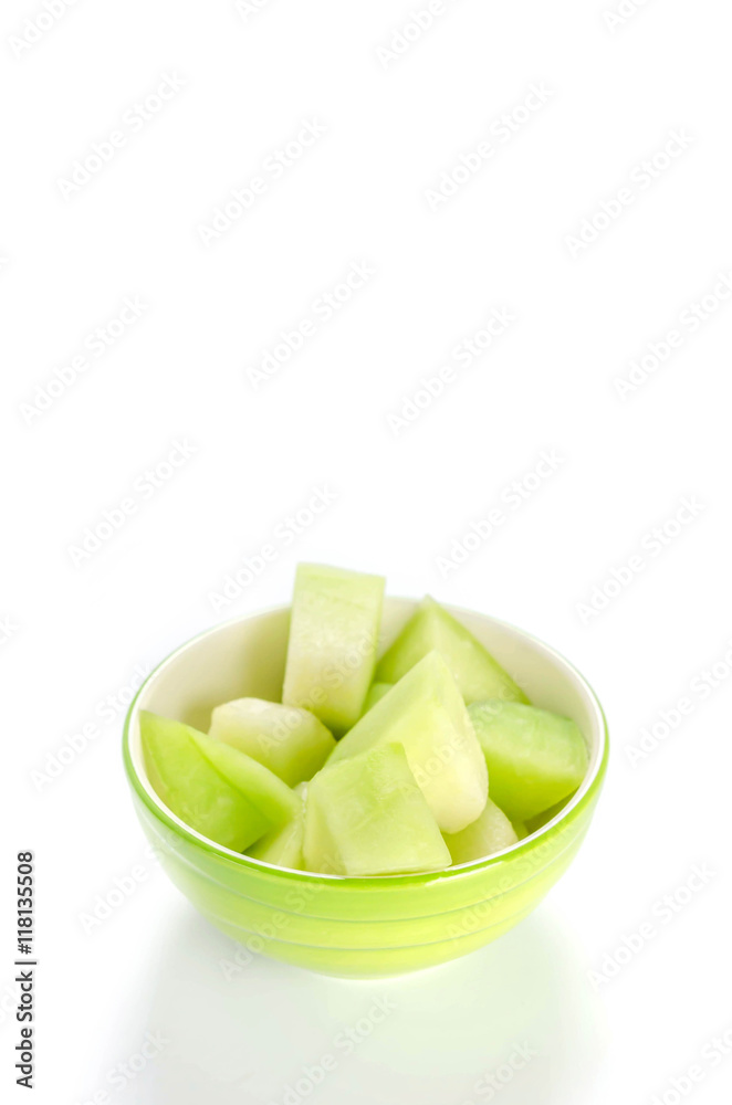 green melon in bowl