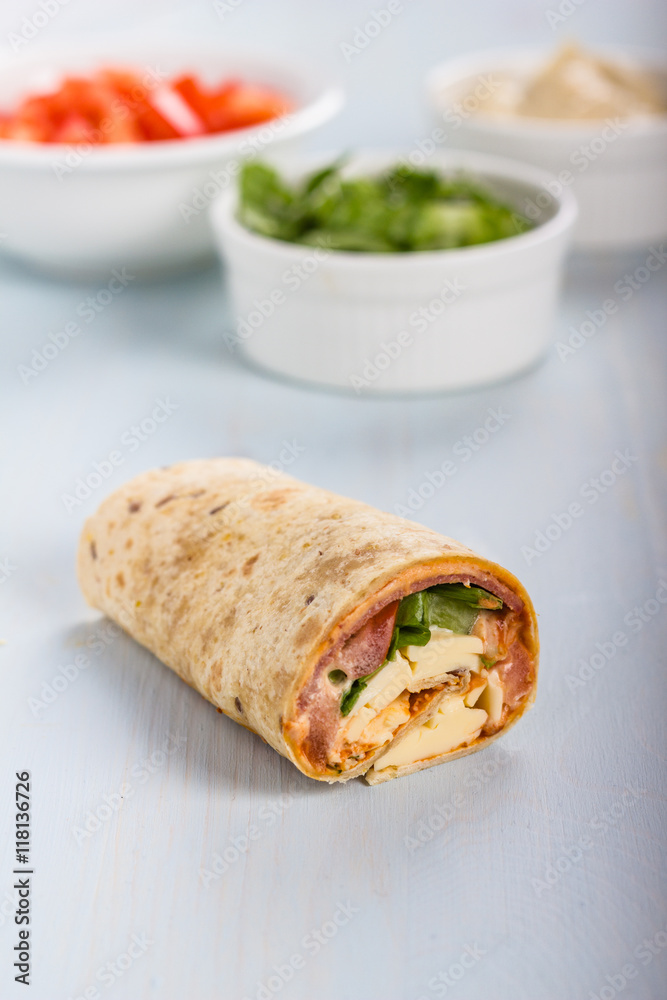 Wrap with tomato, lettuce, harissa and hoummous. Wrap with tomato, lettuce, harissa and hoummous.