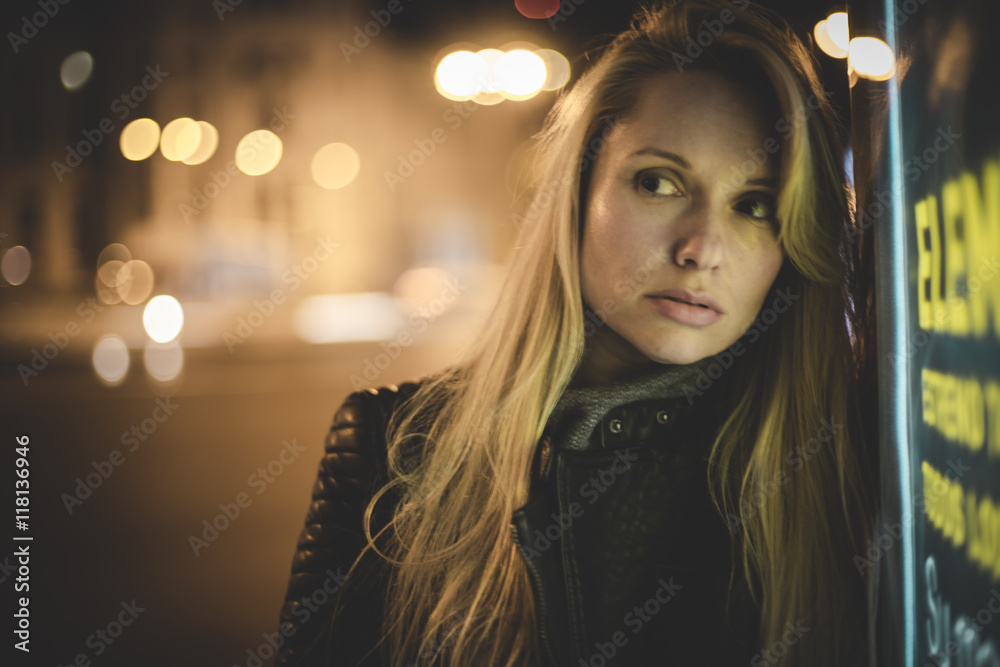 Street, sensual blond in the city at night, with neon lights and Street, sensual blond in the city at night, with neon lights and