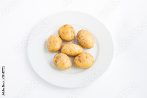 Potatoes on a plate white background