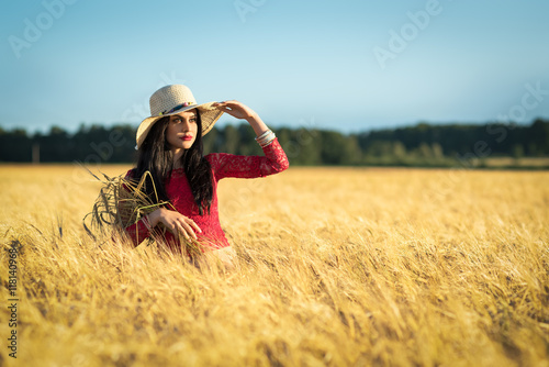 Brunette girl in the wheat field