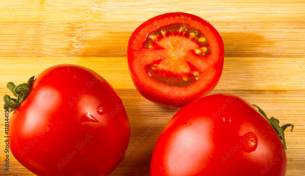 omatoes on wooden background omatoes on wooden background