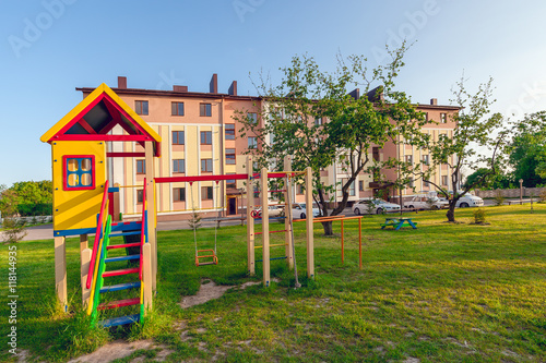 playground of children's near a house. vintage photo