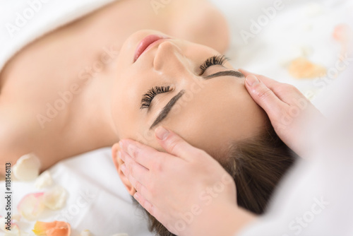 Skillful masseuse massaging human head