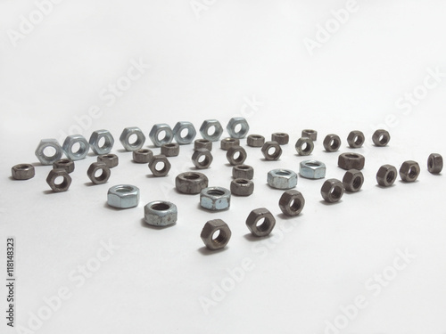 hex nuts of different sizes, beautifully positioned, in lines