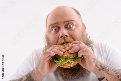 Fotografia Man eating a sandwich