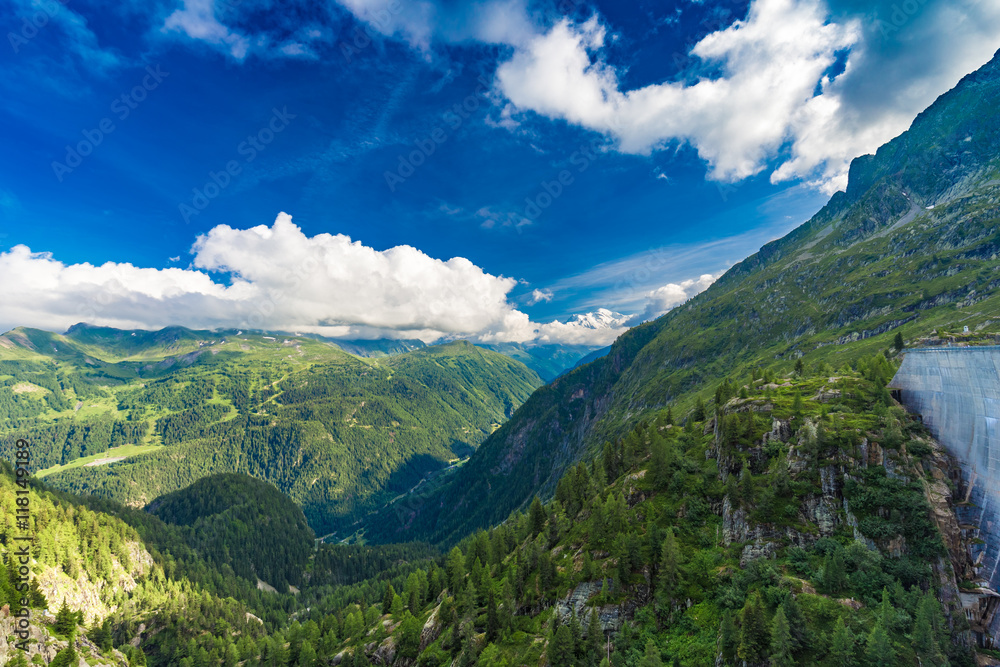 View of the valley behind Emosson Dam and Mont-Blanc peak on horizon View of the valley behind Emosson Dam and Mont-Blanc peak on horizon