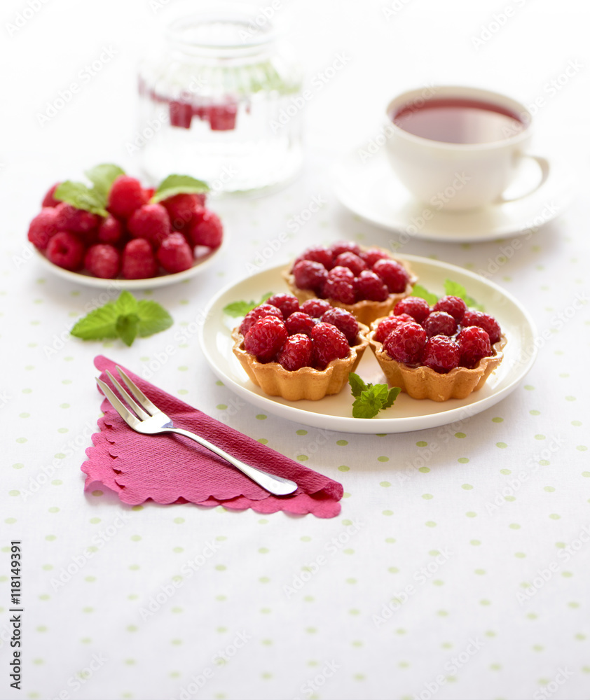 Fruit raspberry tart cakes on a table Fruit raspberry tart cakes on a table