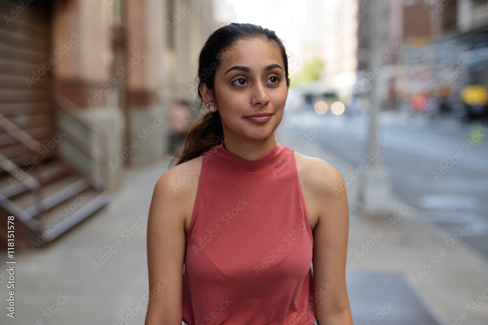 Young woman in city walking smile happy face
